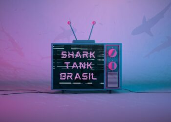 Uma televisão com a frase "SHARK TANK BRASIL" e sombras de tubarões em volta da TV.